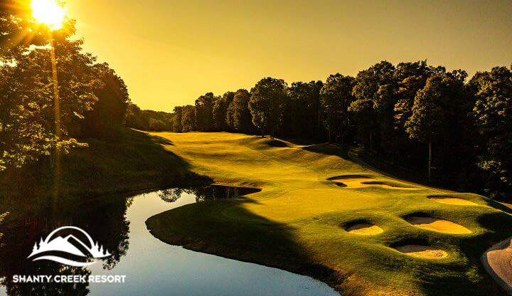 The sun rising on a beautiful golf course